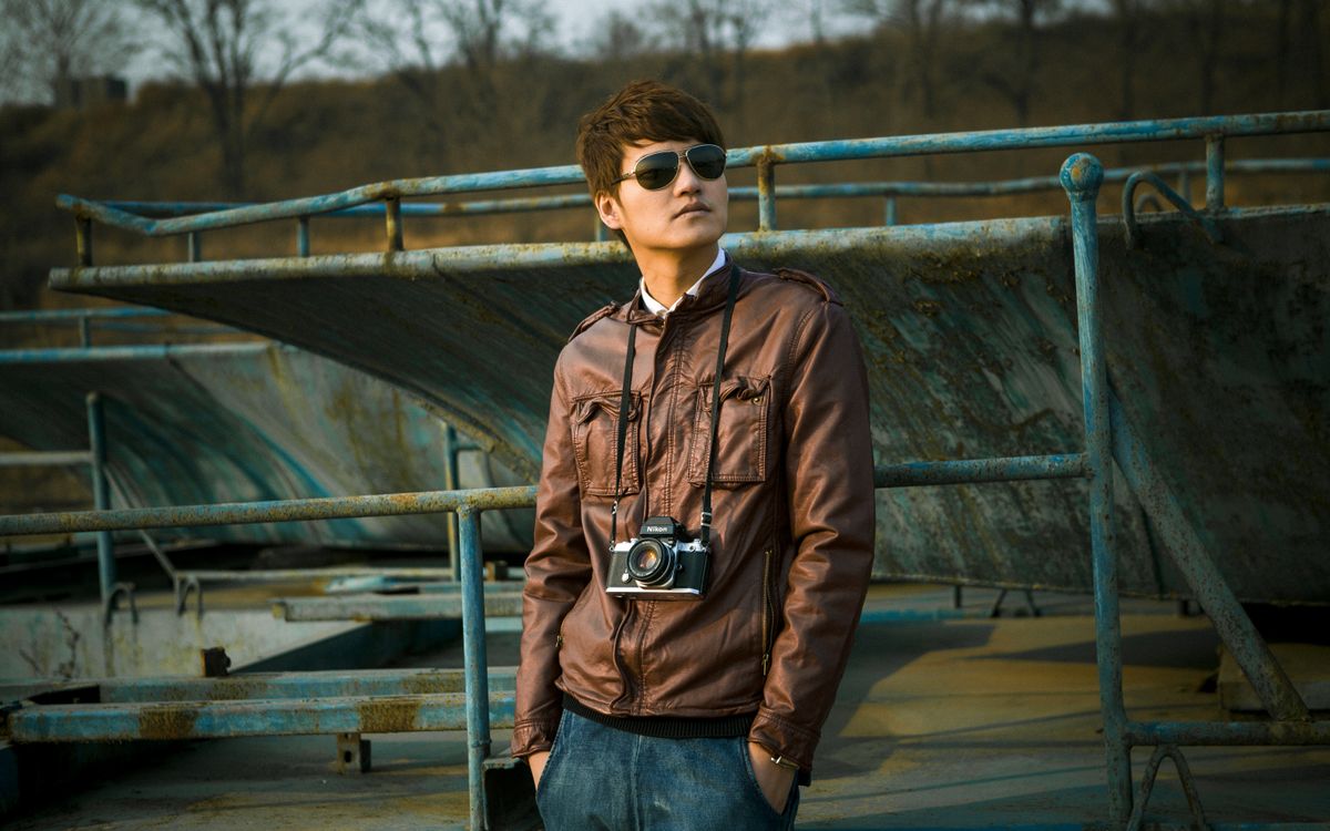 A stylish individual in a leather jacket, capturing leather's everyday versatility