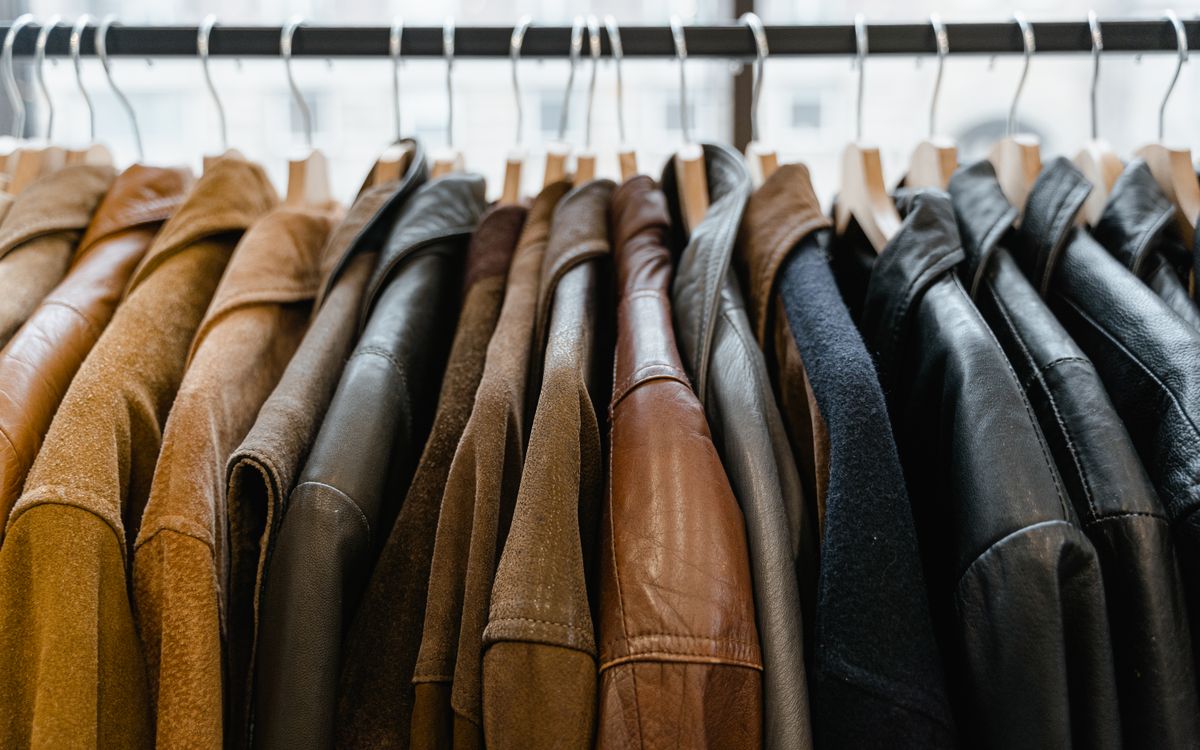 Leather jackets hanging neatly on a rail inside a store