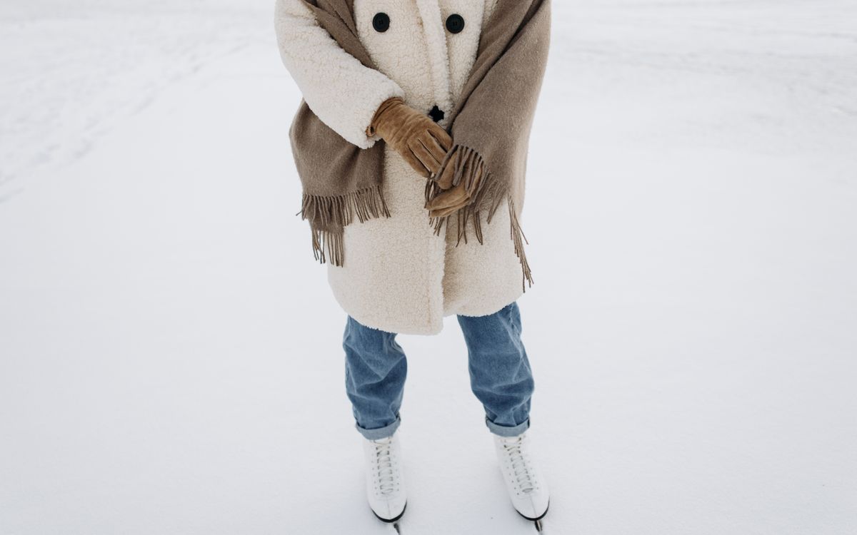 Woman in a warm coat outdoors in soft winter light