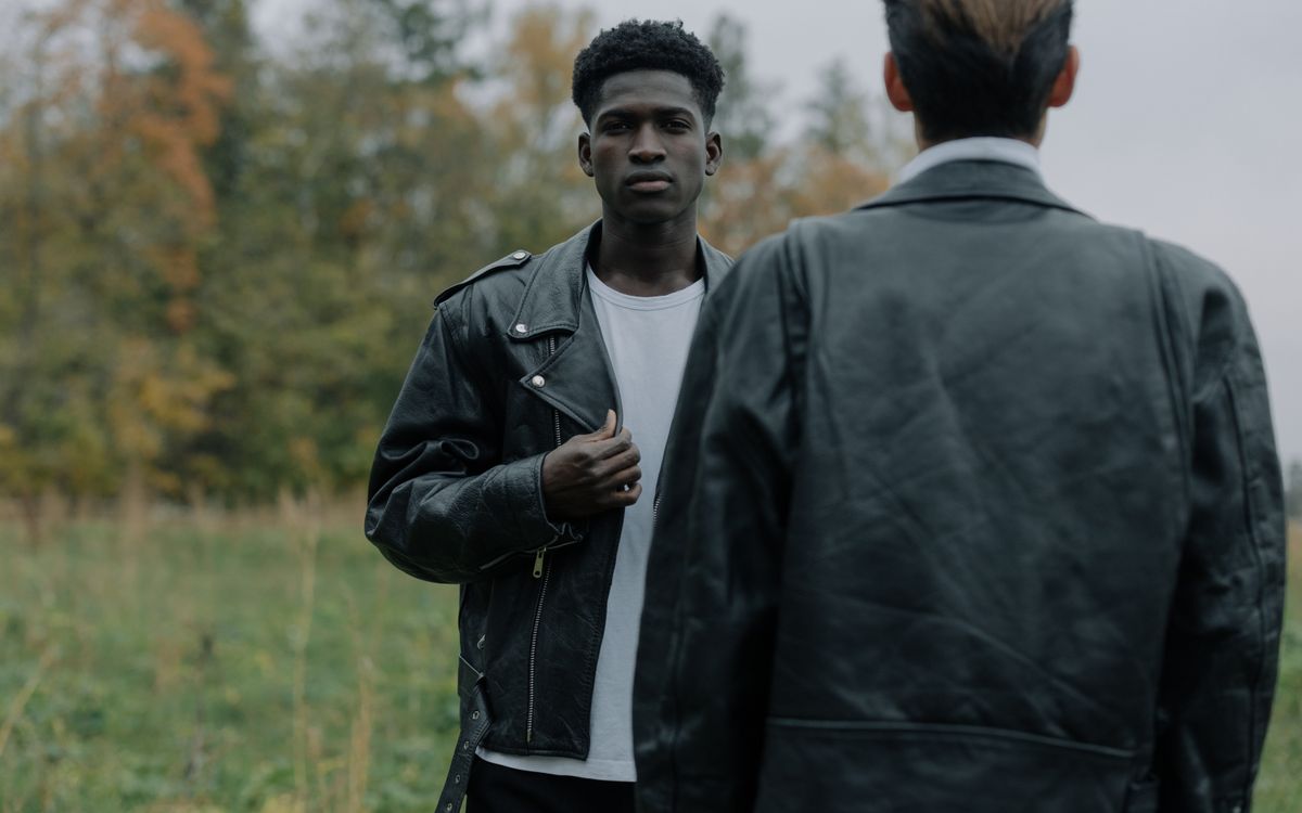 Stylish men in leather jackets outdoors, perfect for fashion and lifestyle themes