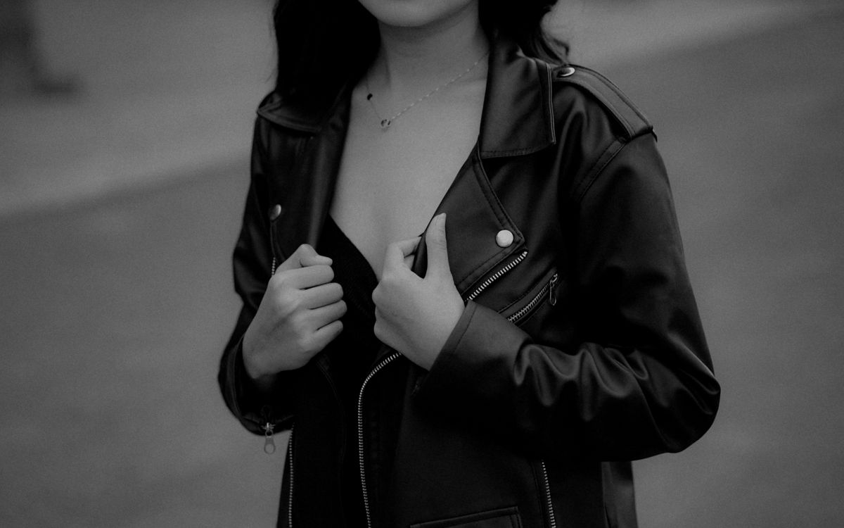 Elegant portrait of a woman wearing a stylish black leather jacket