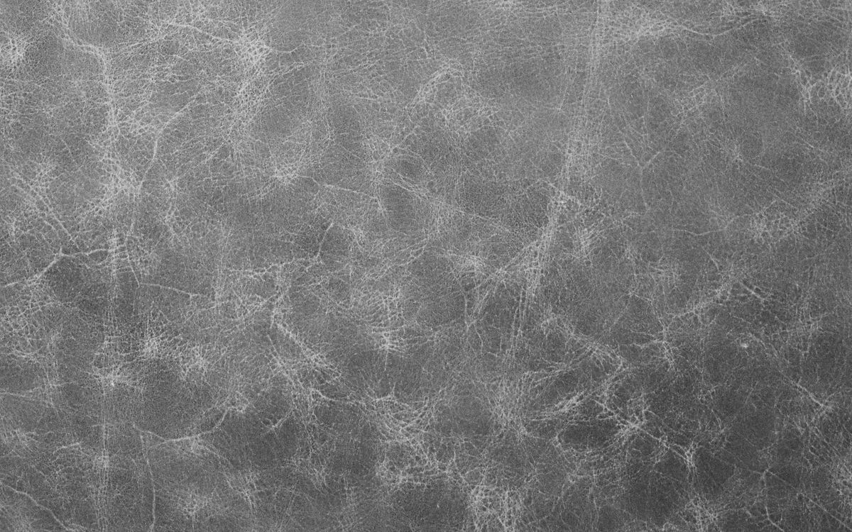 Close-up of soft grey leather grain showing surface texture in detail