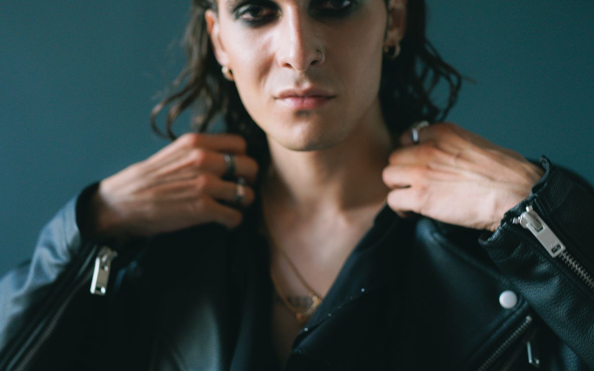 A man in a leather jacket, close styling portrait